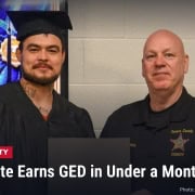 Fostoria News Jail inmate and sheriff's officer at GED graduation ceremony in Seneca County.